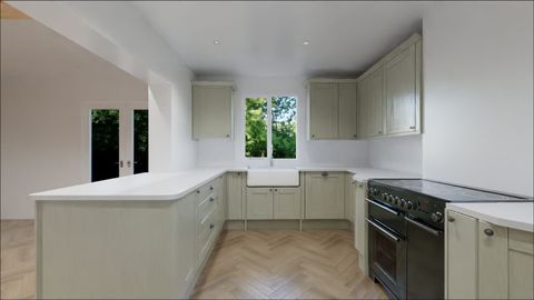 Herringbone wood flooring laid through a newly fitted kitchen