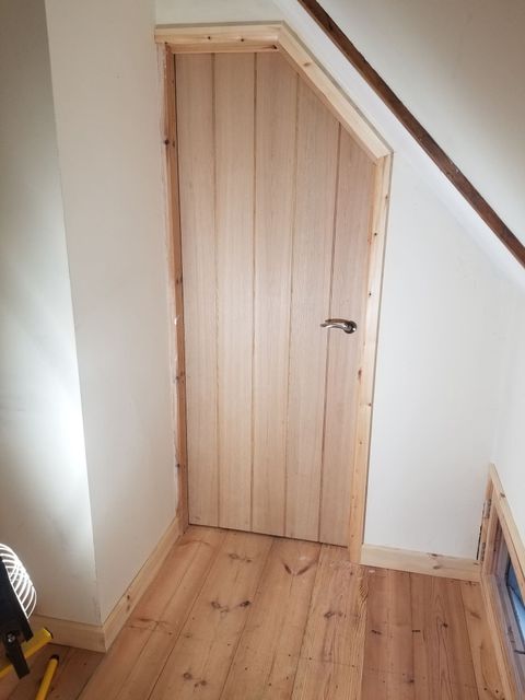 New oak internal door hung in an oak-lined frame